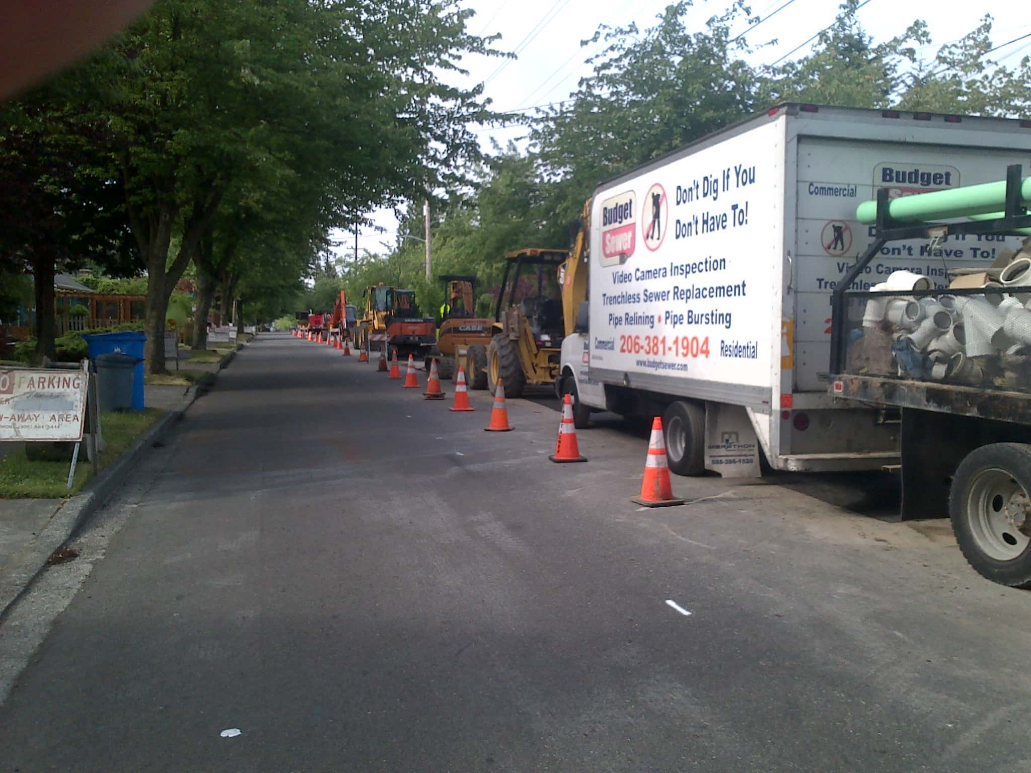 Budget Sewer Truck on the street and sewer repairs