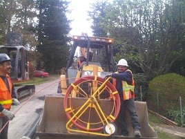 budget sewer van workers doing trenchless pipe repair