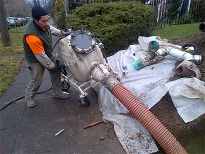 budget sewer worker doing sewer repairs